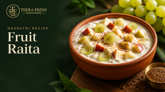 Fruit raita with apple, pear and green grapes in a terracotta bowl
