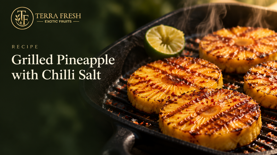 Grilled pineapple rounds with chilli salt in a cast-iron pan