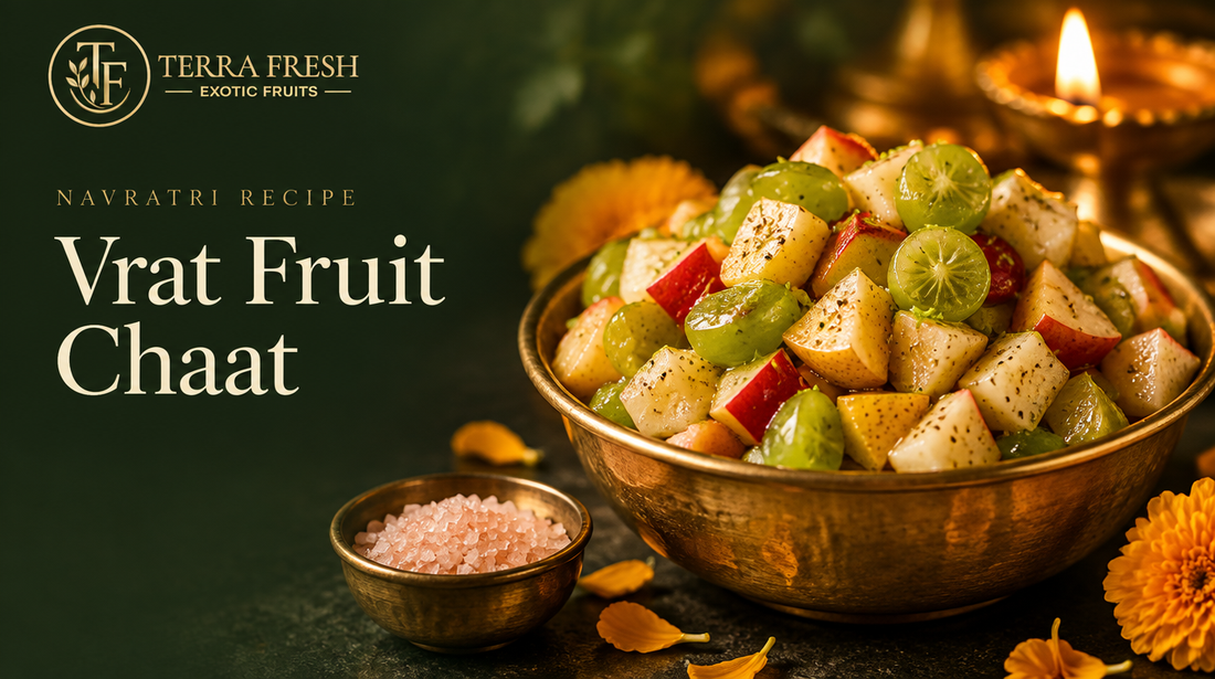Vrat fruit chaat in a brass bowl with rock salt and a diya
