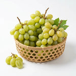 Fresh green muscat grapes in a bamboo basket, sweet seedless variety
