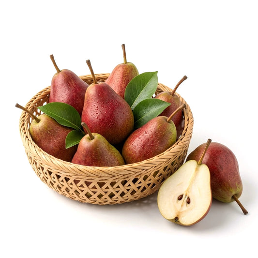 Fresh Red Beauty pears in a bamboo basket with one cut in half showing creamy white flesh